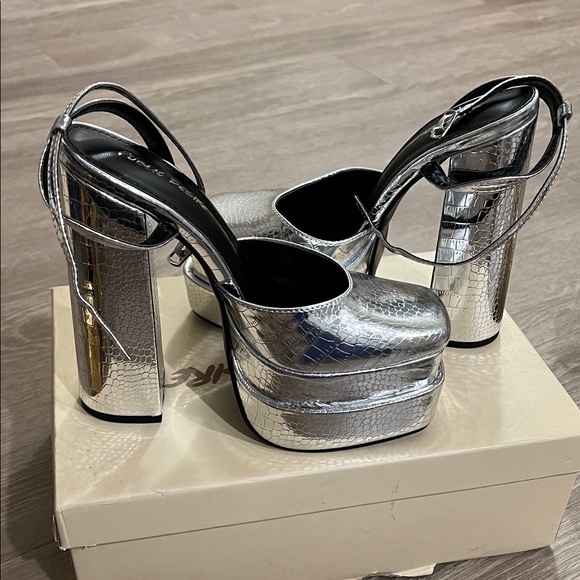 Public Desire Metallic Silver Platform Heels
Brand new - Picture 2 of 2